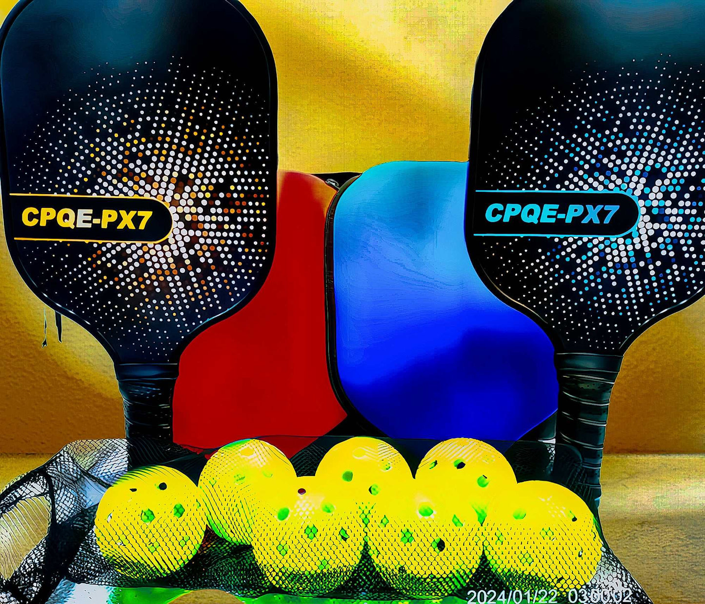 Pickleball bundle with two CPQE fiberglass paddles, neoprene covers, yellow pickleballs, and a mesh bag.