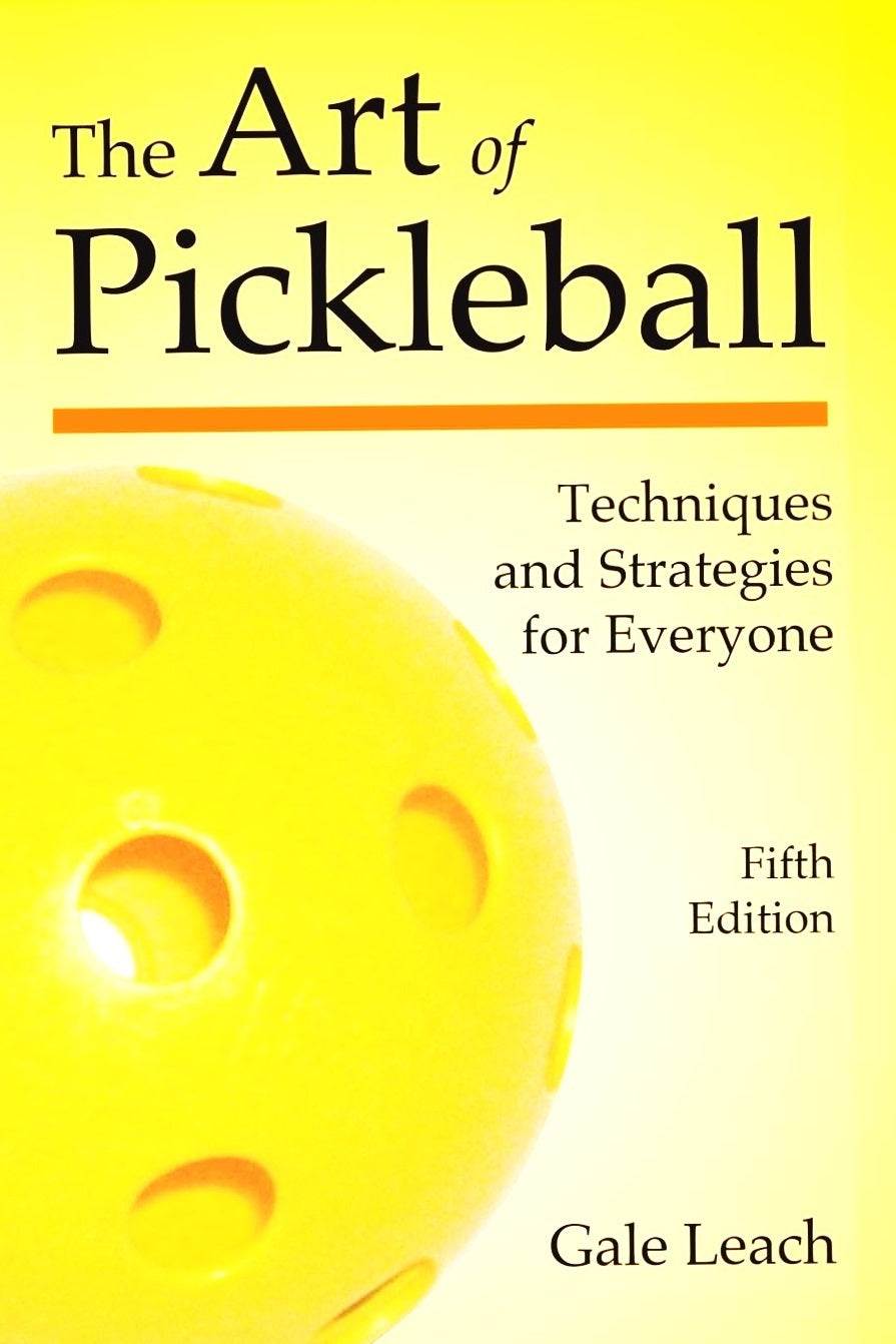 Pickleball techniques book cover with a yellow ball, titled "The Art of Pickleball."