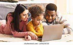 Family engaging with child in educational activities on a laptop, promoting parent involvement.