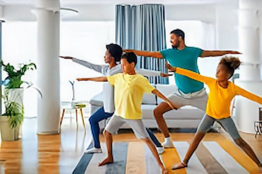 Family practicing dynamic warmup stretches at home.