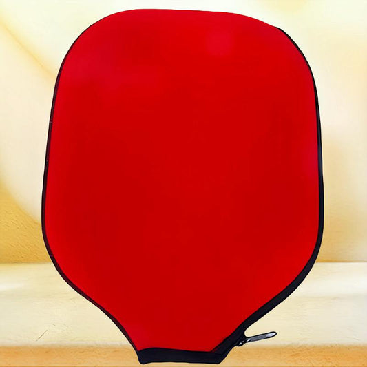 Red pickleball paddle cover with black trim, offering protection against wear and scratches.